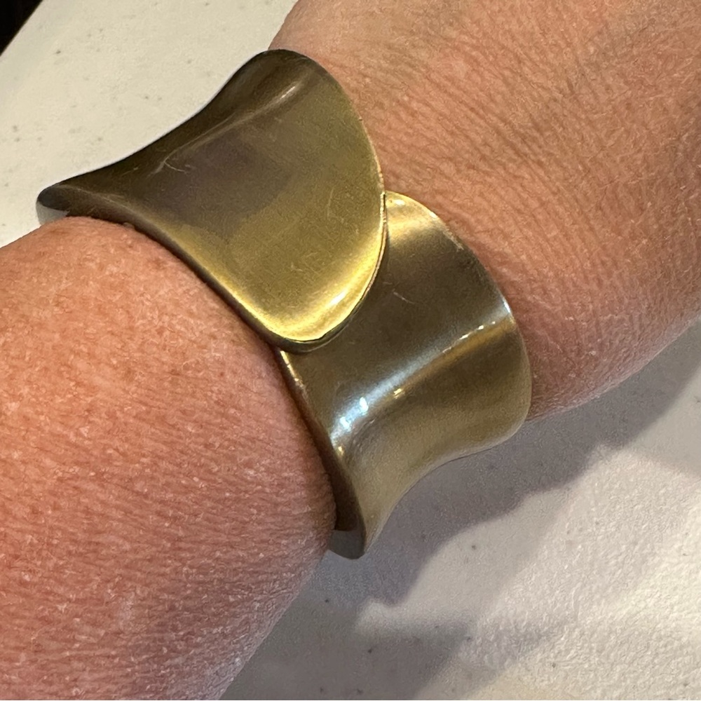 NWT AJ’s Bracelet - hinged open bangle.  Wide brushed brass tone